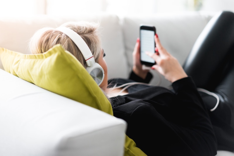 top, sunday, connection, bedroom, laying, lying down, people, songs, home, relaxation, woman, relaxing, indoors, technology, phone, furniture, women, relax