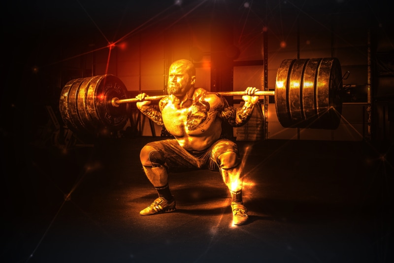 athletic, dark, heavy, power, adult, front view, indoors, training, exercise, holding, muscular, strength, athlete, muscular build, illuminated, exercising