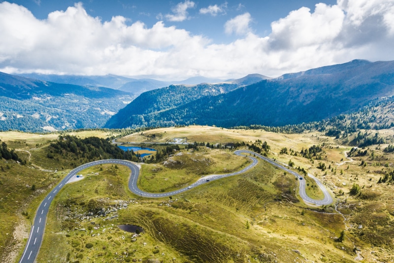 from the plane, petrolheads, roadtrip, drive, cars, mountain road, mountain, mountains, tranquil scene, cloud - sky, non-urban scene, grass, alpine, curvy