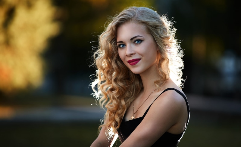 face, curly hair, teenager, fashion, blonde, smiling, long hair, make-up, one person, lipstick, wavy hair, women, makeup, headshot, young adult, beautiful woman