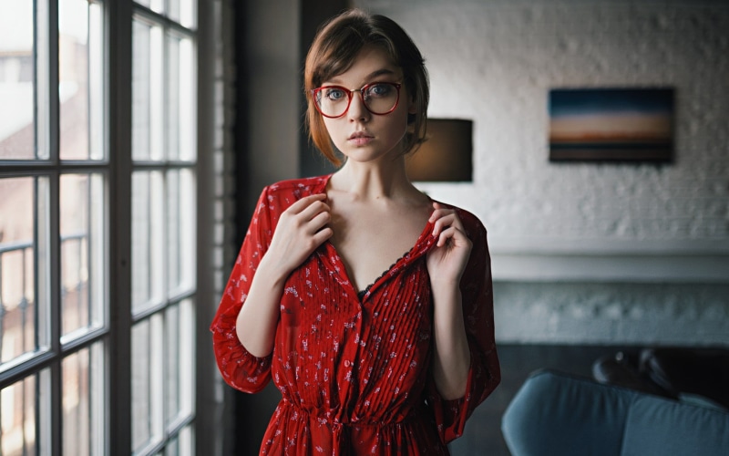 model, teenager, red, one person, dress, women with glasses, portrait, women, waist up, window, standing, contemplation, hairstyle, front view, women indoors