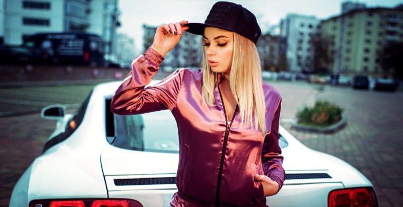 mode of transportation, hair, portrait, architecture, sportswear, city life, transportation, city, land vehicle, women outdoors, one person, fashion, standing