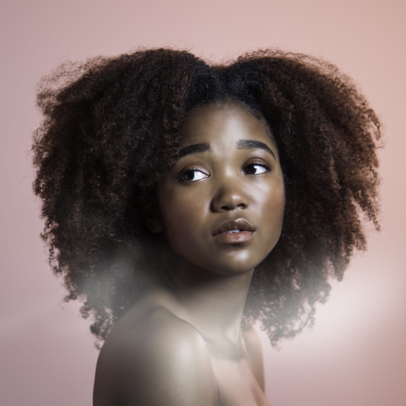 hairstyle, colored background, photo, female, front view, 2K, body part, innocence, one person, black hair, contemplation, human face, african american