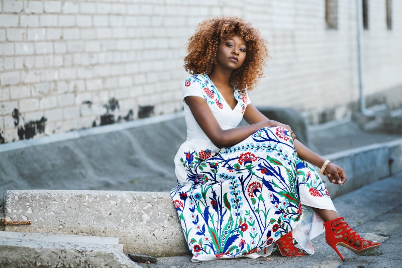 concrete, casual clothing, model, wearing, one person, sitting, beauty, dress, women, wear, red, architecture, full length, block, hairstyle, frizzy, young women