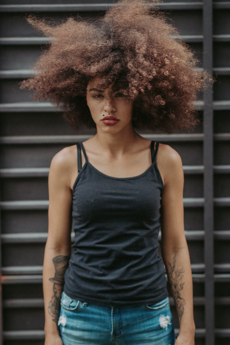 waist up, jeans, looking at camera, indoors, casual clothing, portrait, 5K, posing, beautiful, top, cute, standing, big, beautiful woman, hairstyle, pretty