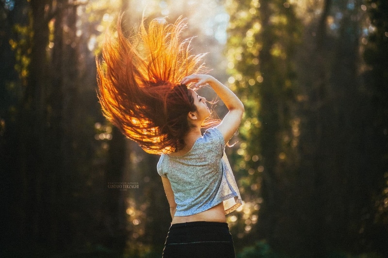 hair toss, human arm, long hair, model, nature, day, lifestyles, arms raised, freedom, one person, dancing, hairstyle, casual clothing, tousled hair, redhead