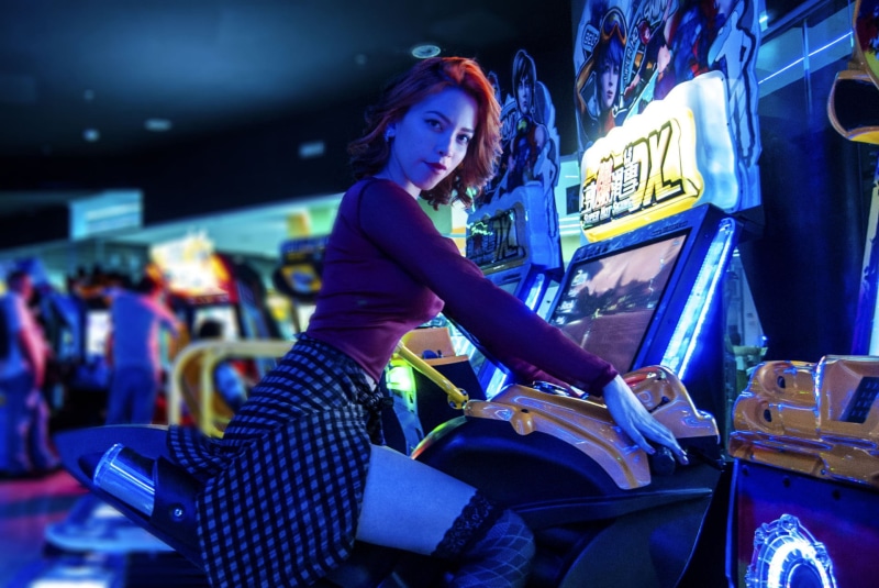 young adult, lifestyles, night, video games, 500px, one person, indoors, incidental people, young women, 1080P, sitting, hairstyle, nightlife, casino
