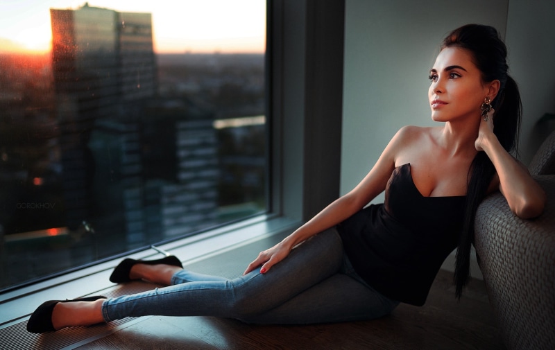 ponytail, window, sweetheart, fitness model, relaxation, lifestyles, black, bare shoulders, looking away, indoors, beautiful woman, jeans, high heels, looking
