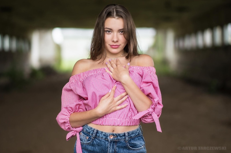 pink color, hands on chest, pink shirt, smiling, depth of field, looking at camera, pink nails, hair, women outdoors, real people, brunette, model, contemplation
