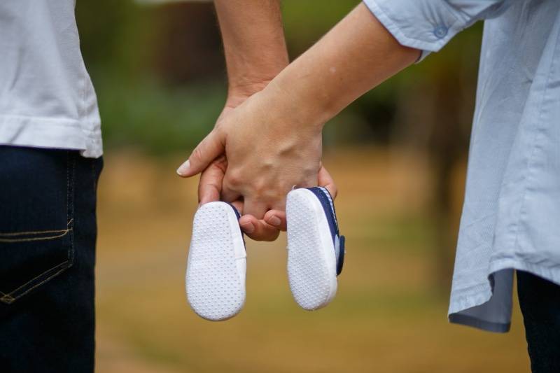 close-up, care, boy, shoes, love, human limb, pregnancy, leisure activity, man, pair, woman, limb, body part, two people, human body part, midsection, family