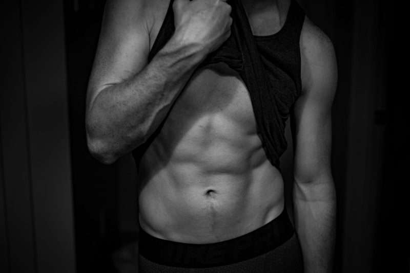 exercising, standing, fitness, arms, midsection, shirtless, abdominal muscle, black and white, human body part, healthy lifestyle, athletic, body, grayscale