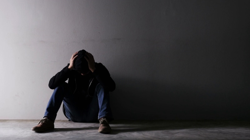 one person, contemplation, lifestyles, 4K, indoors, wall - building feature, flooring, real people, dark, worried, full length, emotional stress, sitting