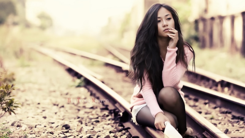 rail transportation, hopelessness, cheerful, pink, brunette, s, retro Styled, sunlight, loneliness, portrait, females, adult, railroad Track, one Person