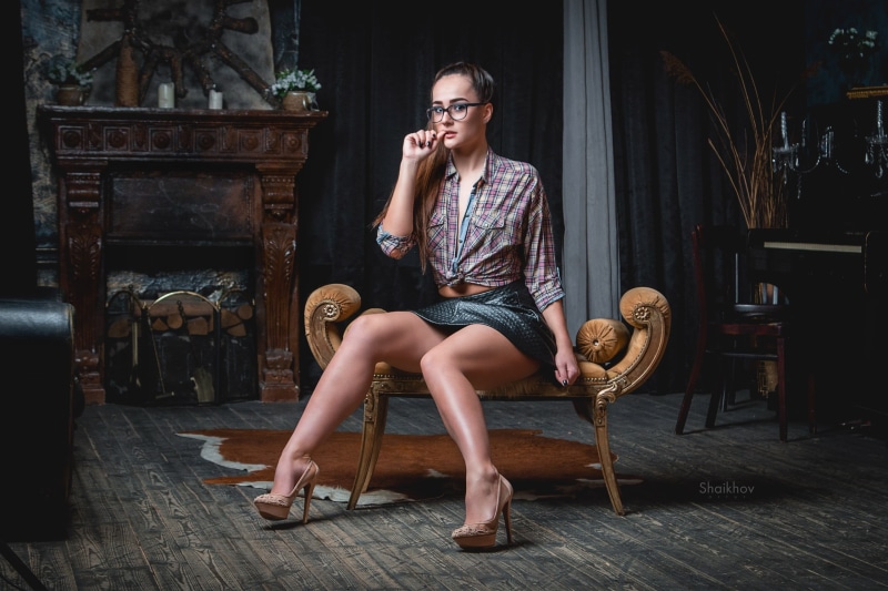 adult, sport, lifestyles, finger on lips, indoors, mid adult women, one person, skirt, hairstyle, shirt, young women, painted nails, wooden surface, fashion