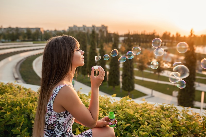 holding, women, happiness, playing, caucasian Ethnicity, bubbles, enjoyment, relaxation, plant, dress, hair, outdoors, girls, springtime, s, child, white