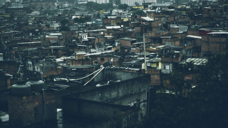 building, outdoors, favela, community, architecture, settlement, house, street, day, old, built structure, city life, roof, building exterior, crowd, residential district