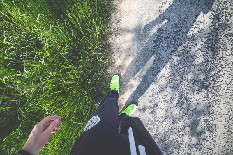 tracksuit, nature, human foot, real people, limb, exercise, sport, green color, adult, adults only, shoe, winter, personal perspective, shadow, one Person