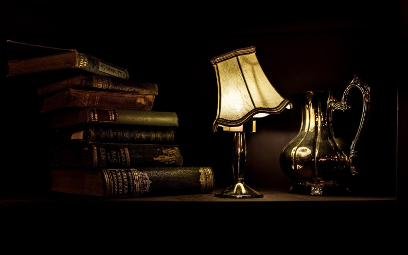 beige, shelf, illuminated, light, pile, close-up, publication, education, hardcover book, 2K, lights, time, indoors, table, books, lamp, the past, no people