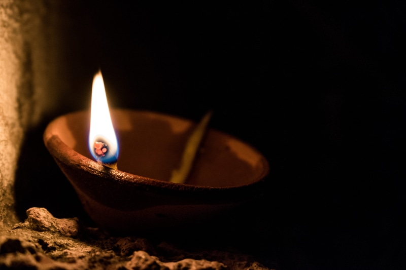 selective focus, celebration, ray, hope, fire - natural phenomenon, black background, electric lamp, festival, close-up, no people, indoors, flame, fire