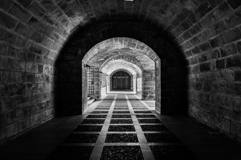 photo, indoors, walls, stone wall, railway, direction, day, arch, empty, diminishing perspective, gothic, bricks, building, brick wall, gate, light at the end of the tunnel