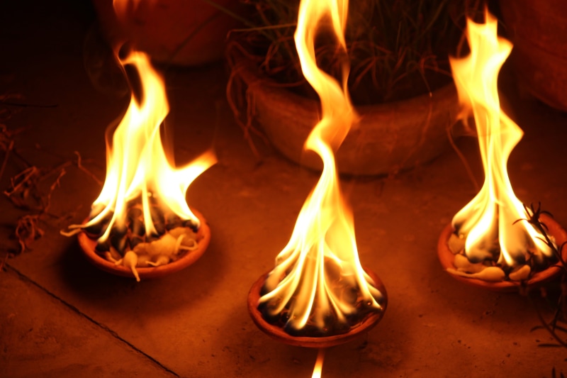 fire, orange color, spiritual, burning diya, pray, heat - temperature, lamp, food and drink, religion, flame, motion, deepavali, decorative, worship, holiday