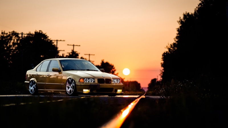 city, sunset, tree, BMW, outdoors, land vehicle, no people, motor vehicle, road, nature, BMW E36, travel, headlight, transportation, plant, sky, orange color