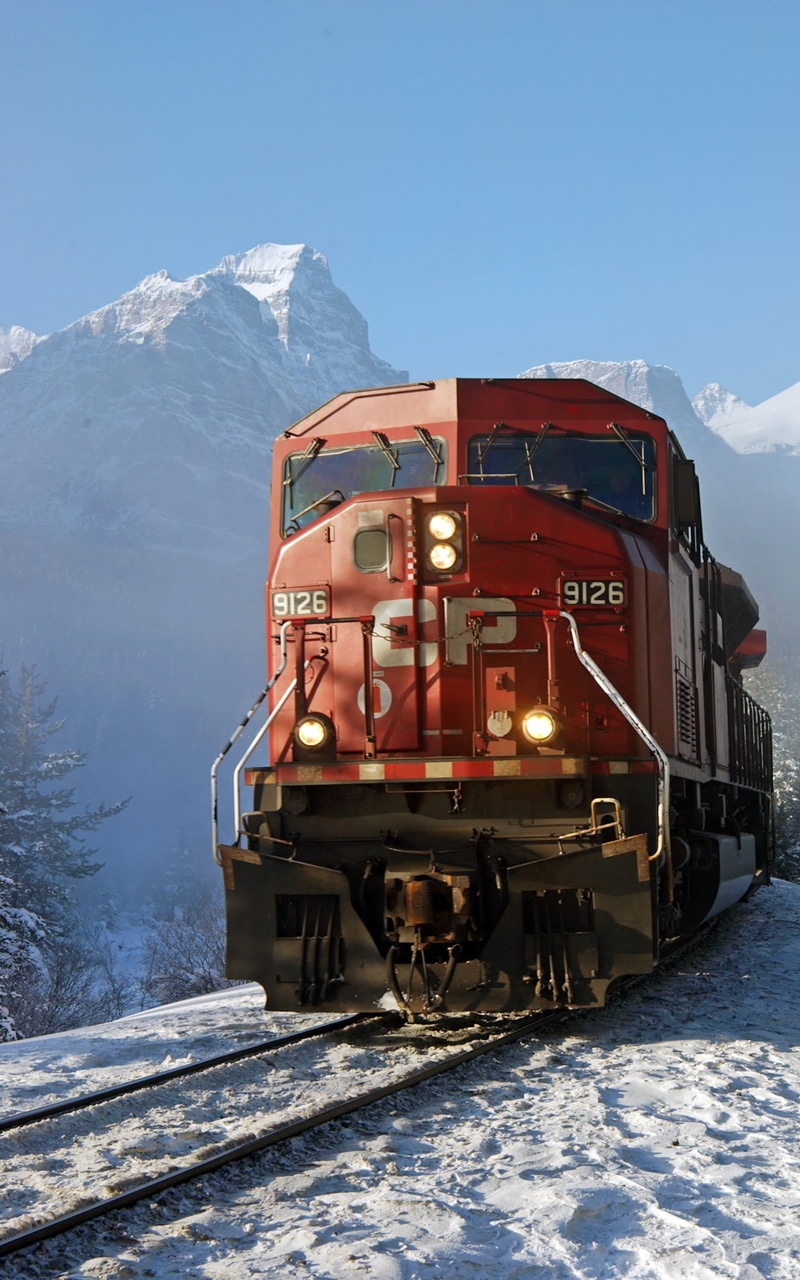 mountain peak, freight train, train, cold temperature, portrait display, transportation, sky, environment, train - vehicle, mountain range, snow, mountain