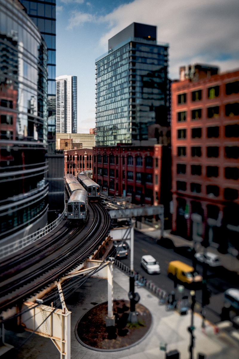 land vehicle, public transportation, road, transportation system, time, street, track, railroad track, skyscraper, train, city life, city, rail transportation