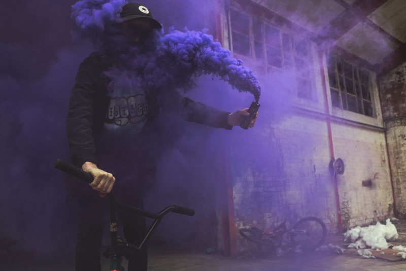 smoke, colourful, occupation, arts culture and entertainment, abandoned building, riding, obscured face, performance, smoke grenade, man, real people, night