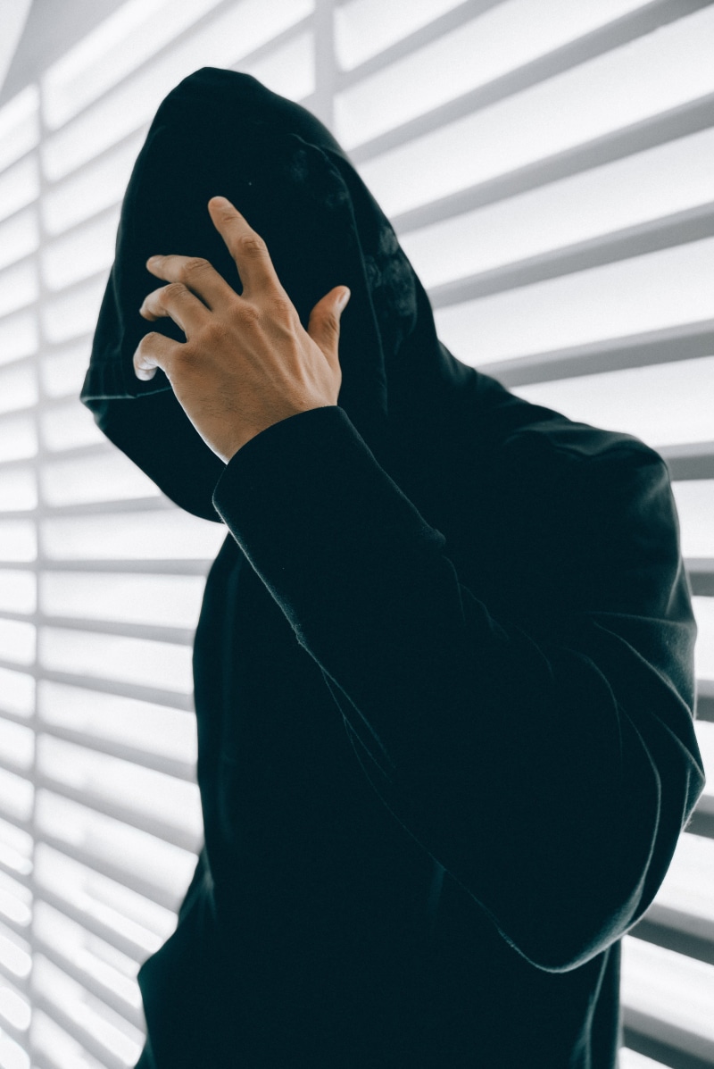 unrecognizable person, 4K, hoodie, front view, inside, urban, person, home interior, black, leisure activity, beside, human hand, waist up, blinds, lifestyles