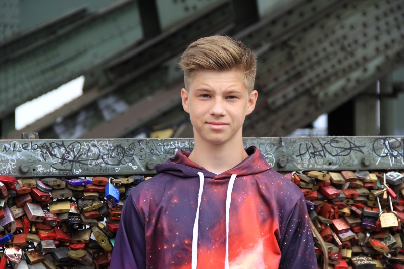 pullover, Male, day, wearing, color Image, real people, Teenager, one Person, face, s, print, standing, portrait, Boy, looking at camera, caucasian Ethnicity