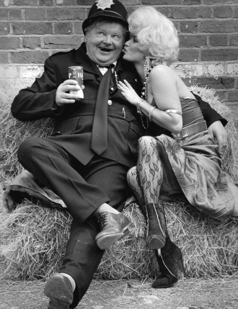 smiling, brick, Vicky Facey, senior women, brick wall, Comedian, real people, beer, portrait, police, senior adult, adult, actress, stockings, mature adult