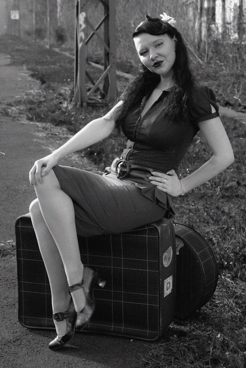 hairstyle, travel, railway station, portrait, luggage, feminine, grayscale, wearing, photo, women, full length, old-fashioned, young adult, one young woman only