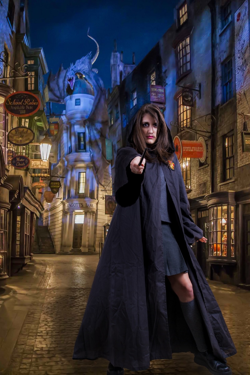2K, magic stick, harry potter world, leisure activity, holding, buildings, photo, looking at camera, built structure, beside, lifestyles, one person, black