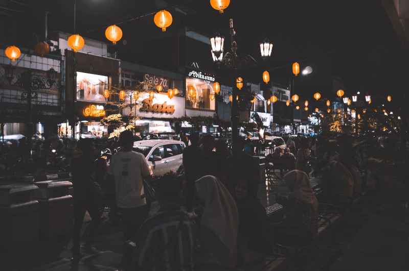 town, large group of people, city, business, crowd, jalan malioboro, built structure, retail, illuminated, urban, small business, street, road, 4K, lifestyles