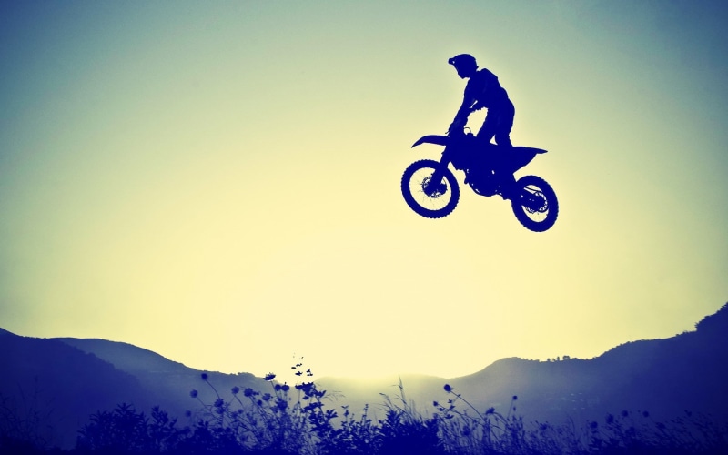 sports helmet, headwear, mid-air, sport, extreme sports, nature, adventure, jumping, biker, mode of transportation, motorcycle, sign, skill, motocross