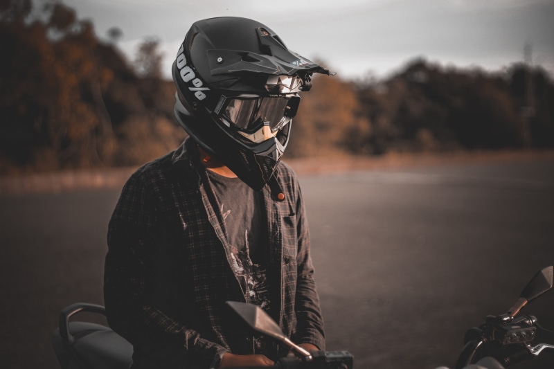 jacket, leisure activity, wearing, mode of transportation, one person, vehicle, crash helmet, lifestyles, motorbike, helmet, outdoors, rider, landscape