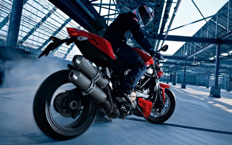 speed, side view, blurred Motion, riding, engine, leisure activity, sports equipment, one person, headwear, people, full length, black, bike, motorcycle