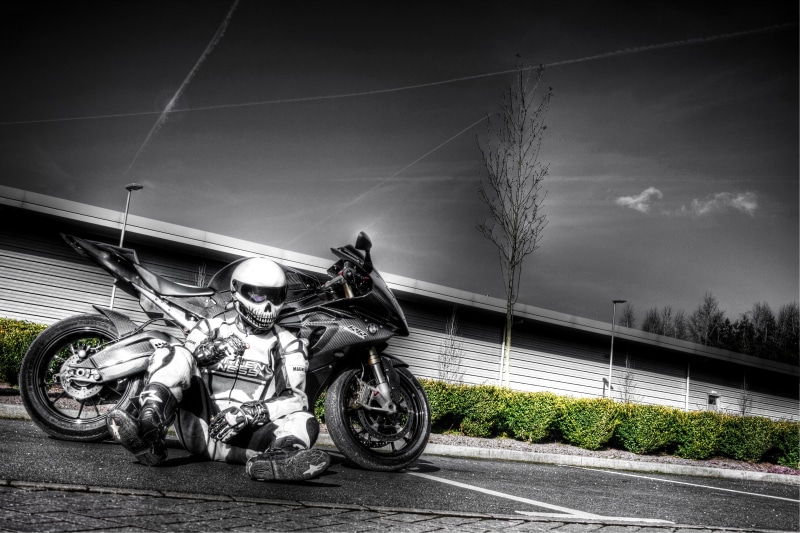 urban Scene, sports helmet, speed, motorcyclist, headwear, biker, street, no People, stationary, sports race, road, mode of Transport, motion, nature, transportation