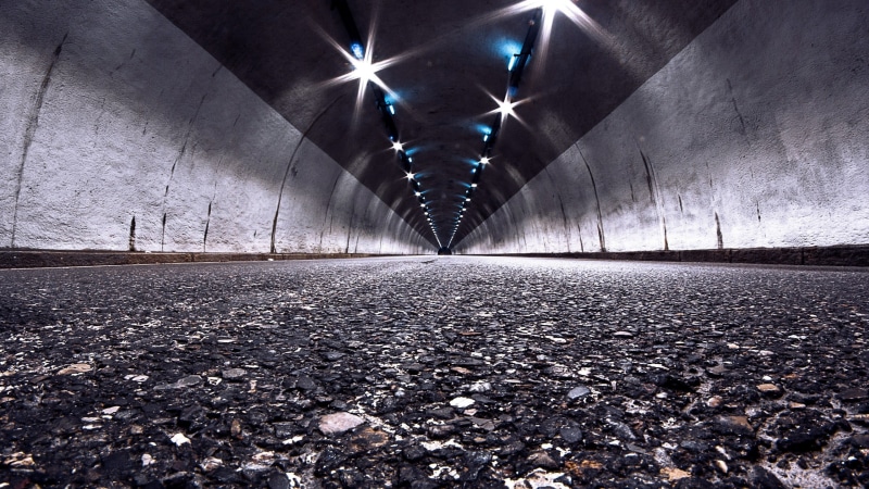 wall, arch, concrete, lighting equipment, indoors, built structure, transportation, lights, architecture, empty, the way forward, surface level, depth of field