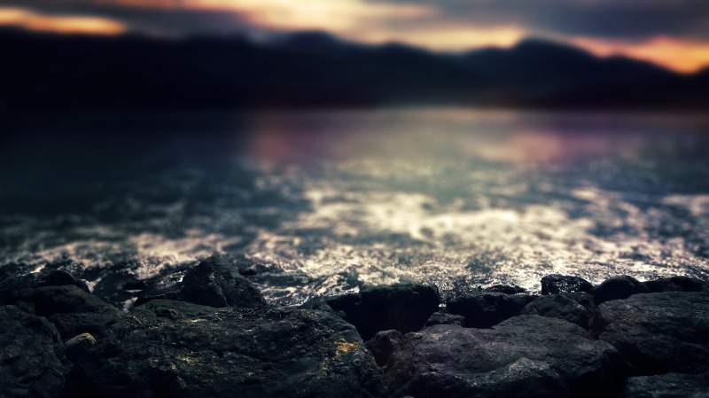 mountain, blue, mountains, coast, heat - temperature, summer, focus on foreground, tranquil Scene, selective focus, stone - Object, land, black, lake, coastline