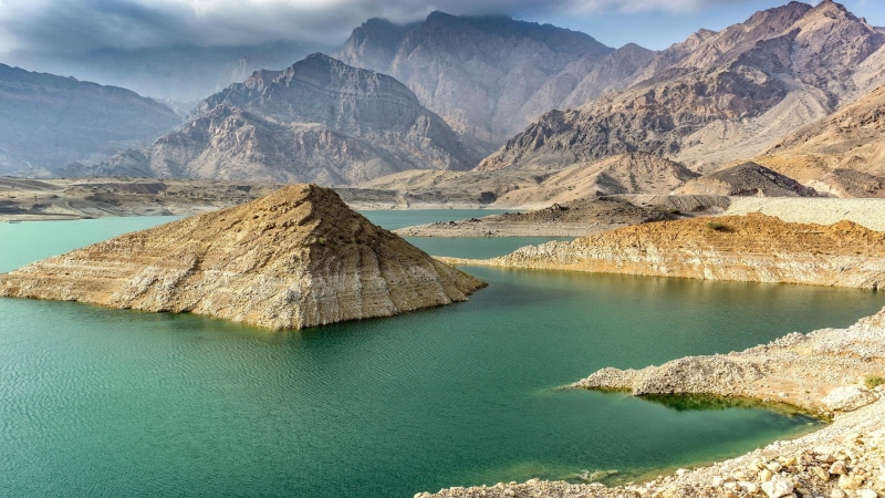 scenics - nature, rock, nature, environment, mountains, tranquility, lagoon, travel destinations, formation, Oman, outdoors, body, mountain, sky, idyllic