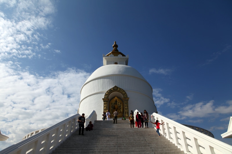 outdoors, direction, day, building exterior, cloud - sky, pokhara, group of people, men, nepal, dome, belief, architecture, the way forward, place of worship