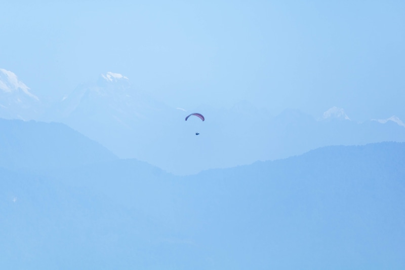 real people, nepal, sports, 4K, one person, day, leisure activities, parachute, pokhara, mid-air, beauty in nature, flying, paragliding, extreme sports