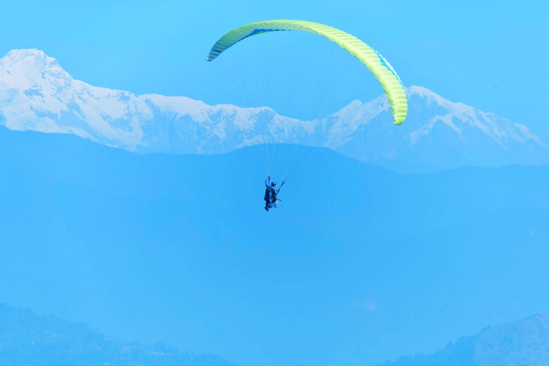 parachute, nature, mountain, unrecognizable person, aircraft, gliding, circus, scenics - nature, sky, flying, extreme sports, exhilaration, blue, mid-air