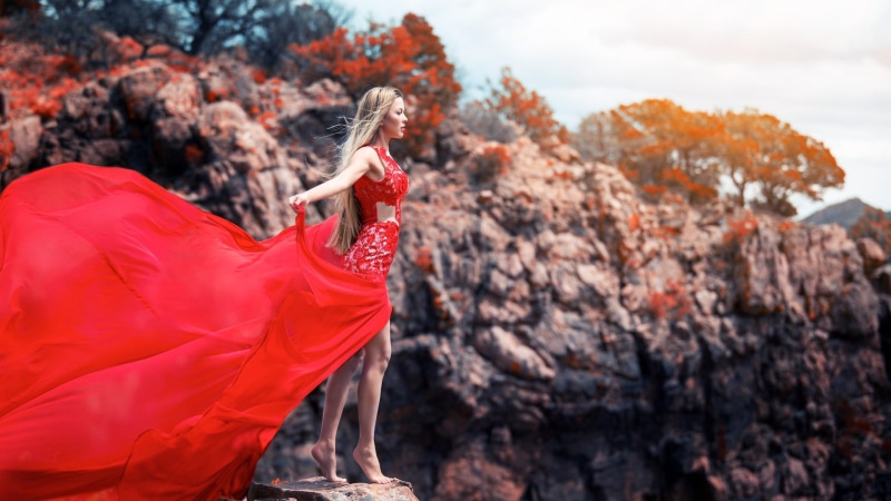 dress, model, 1080P, blonde, red dress, trees, rock, red, barefoot, windy, hair, women, long hair, women outdoors, outdoors, long