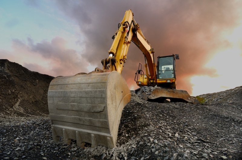 machinery, earth mover, industrial equipment, gravel, cloud - sky, solid, land vehicle, nature, development, construction machinery, construction site