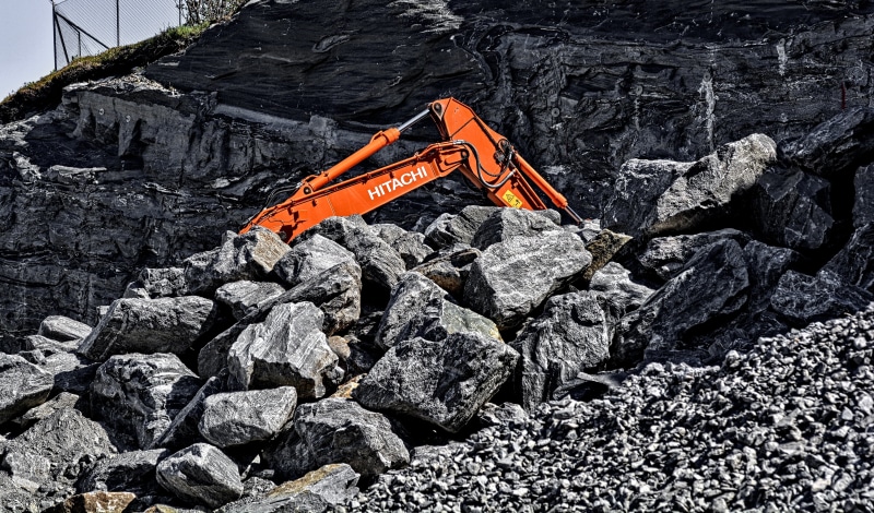 excavator, orange color, machinery, rocks, gravel, rock - object, stone - object, site, solid, stone, heavy, nature, day, construction site, orange, construction industry