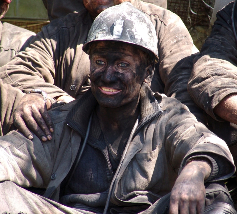 Minerals, One, looking at camera, Miner, one man only, front view, social issues, dirt, Work, portrait, headwear, clothing, coal, hard labour, males, sitting
