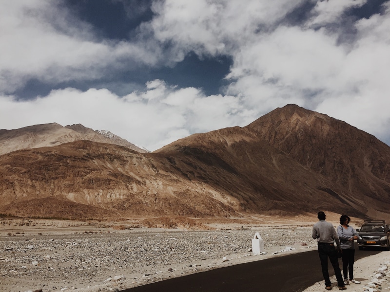 non-urban scene, sky, environment, leh, men, outdoors, people, mountain range, 2K, beauty in nature, lifestyles, real people, leisure activity, arid climate